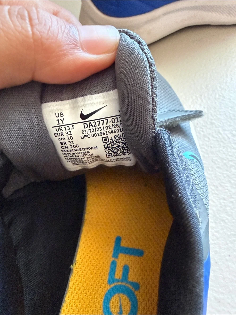 Nike Kids Gray Sneakers with Blue Accents